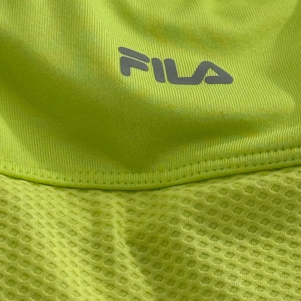 Fila neon yellow green mini skort w/ multicolor butterfly pattern